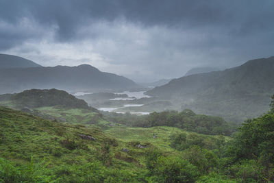 Scenic view of landscape and mountains against sky