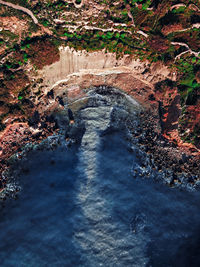 High angle view of water flowing through land