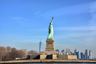 Low angle view of statue against cloudy sky