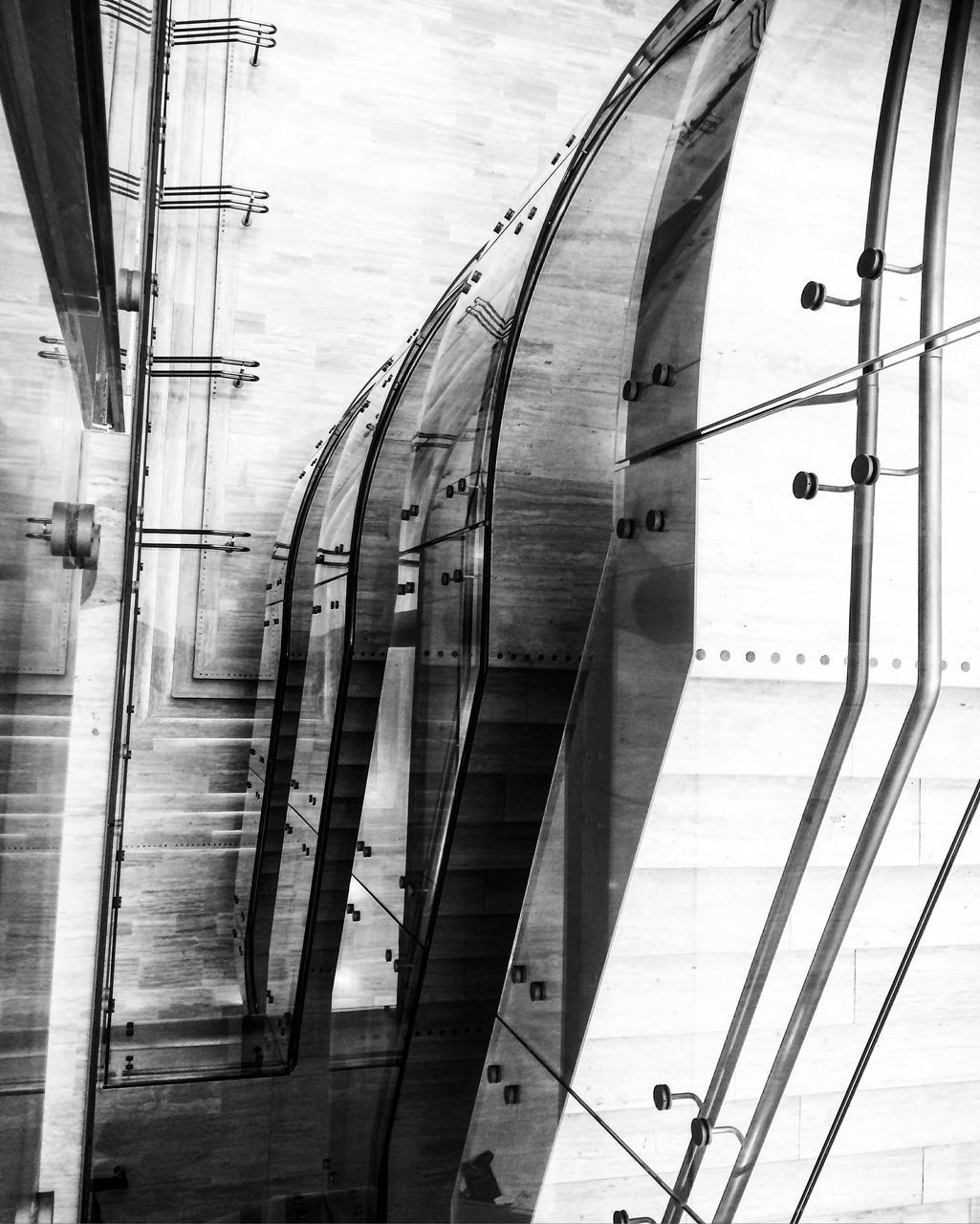 CARS ON RAILWAY BRIDGE AGAINST SKY