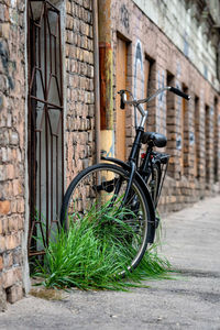 Bicycle parked against wall in building