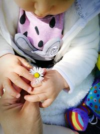 Close-up of woman with tattoo on hand