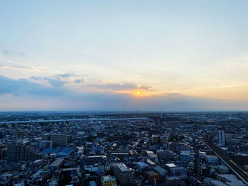 High angle view of city against sky during sunset