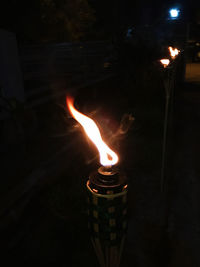 Close-up of fire burning in dark