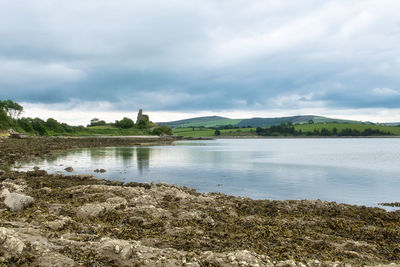 Ses inlet with background castle ruin donegal, ireland