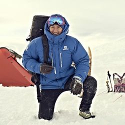 Full length of friends on snow covered mountain