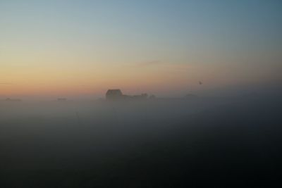 Scenic view of landscape against sky during sunset