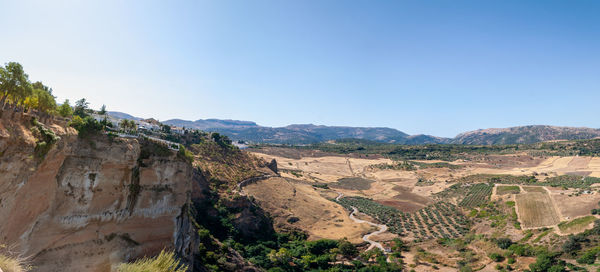 Panoramic view of landscape against clear blue sky