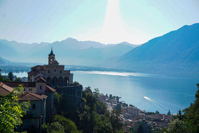 Panoramic view of sea and buildings against sky