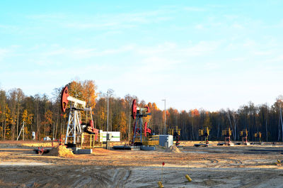 Construction site by road against sky