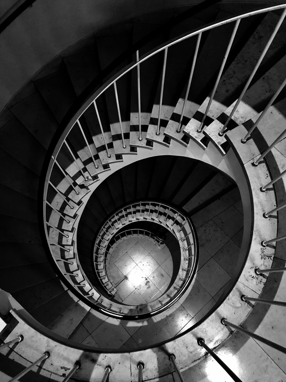 staircase, steps and staircases, spiral, steps, railing, spiral stairs, architecture, stairs, built structure, high angle view, in a row, hand rail, no people, spiral staircase, indoors, day