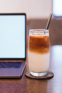 Close-up of coffee cup on table