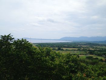 Scenic view of landscape against cloudy sky