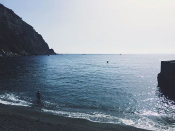 Aerial view of person in sea against sky