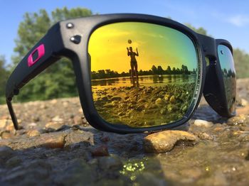 Reflection of sunglasses on side-view mirror