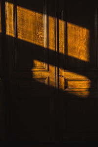 Full frame shot of wooden door in bright room