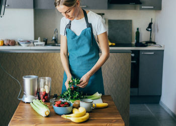 Midsection of man preparing food at home