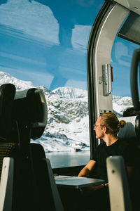 Looking through window, snowy mountains, panoramic view