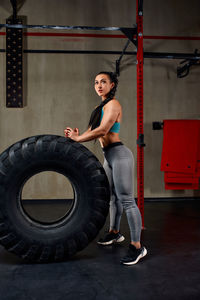 Side view of man exercising in gym