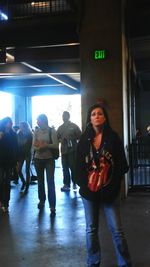 Rear view of young woman walking on floor