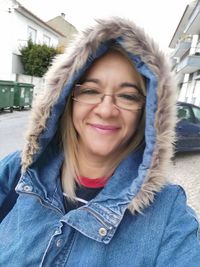 Portrait of smiling young woman in winter