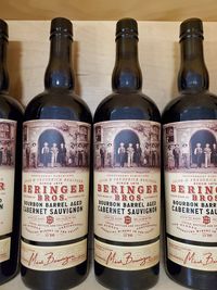 Close-up of wine bottles on table