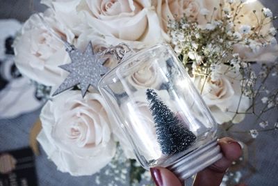 Close-up of hand holding christmas decoration