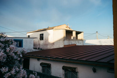 Low angle view of houses against sky