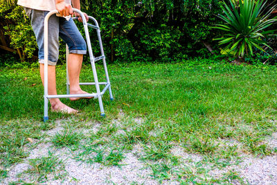 Low section of man standing in yard