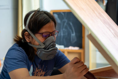 Portrait of boy sitting at home