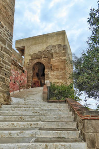 Low angle view of old building against sky