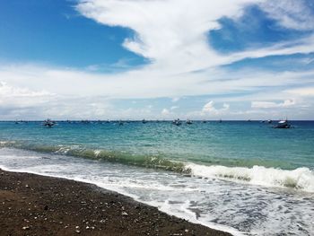 Scenic view of sea against cloudy sky