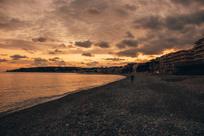 Scenic view of beach against sky during sunset