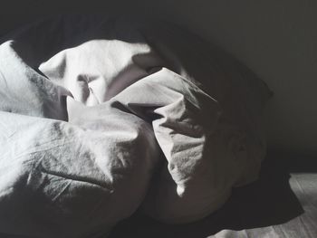 Sunlight falling on sheet in bedroom at home