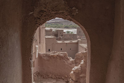 View of old building through window
