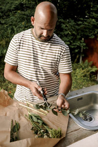 Midsection of man preparing food