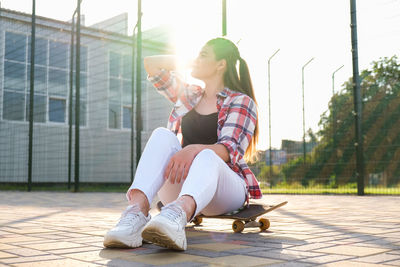 Woman sitting outdoors