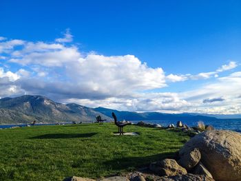 Scenic view of landscape against cloudy sky