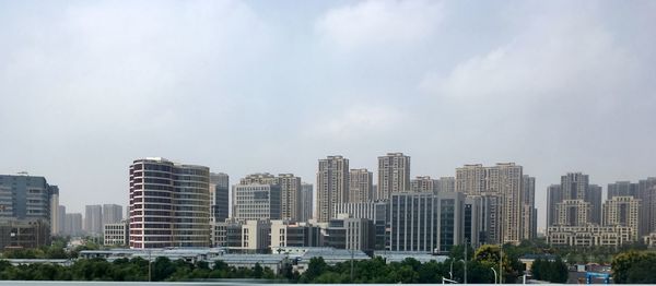 Buildings in city against sky