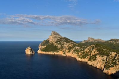 Scenic view of sea and rock formation against sky