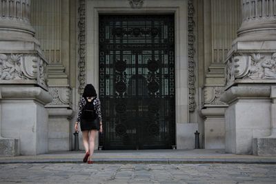 Full length of woman walking in building