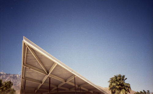 Low angle view of built structure against clear blue sky