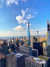 Modern buildings in city against sky