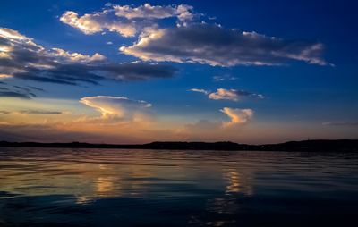 Scenic view of sea against sky at sunset