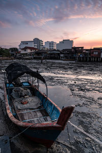 Sunrise view of wooden boat background at clan tan jetty, penang, malaysia.