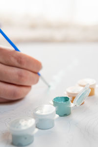 Close-up of hand holding pills