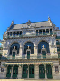 Low angle view of building against blue sky