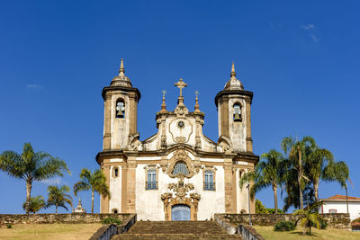 View of historic building against clear blue sky