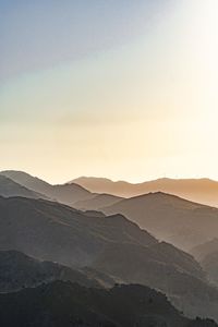 Scenic view of mountains against sky during sunset