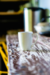Close-up of coffee cup on table